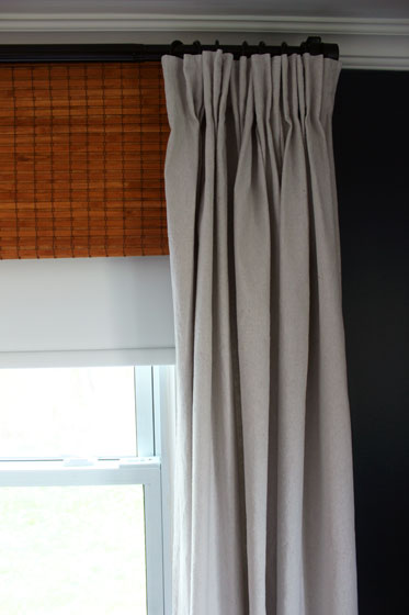 Blackout blind, bamboo blind and drop cloth curtain window treatments
