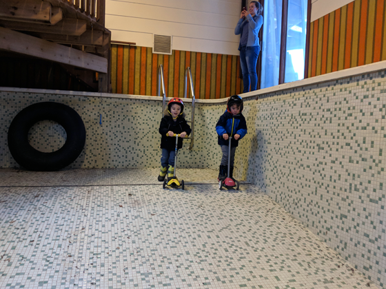 Riding scooters in the indoor pool